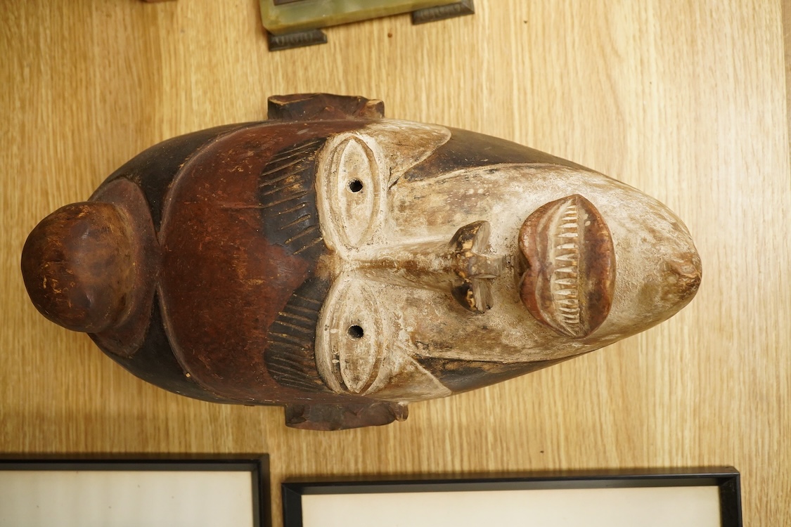 African tribal art interest; a Democratic Republic of Congo carved and painted mask, 36cm